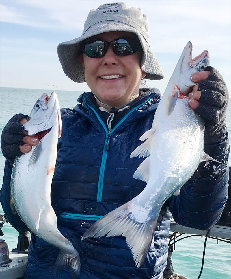 Woman with two fish on Lake Michigan from Captain Mike
