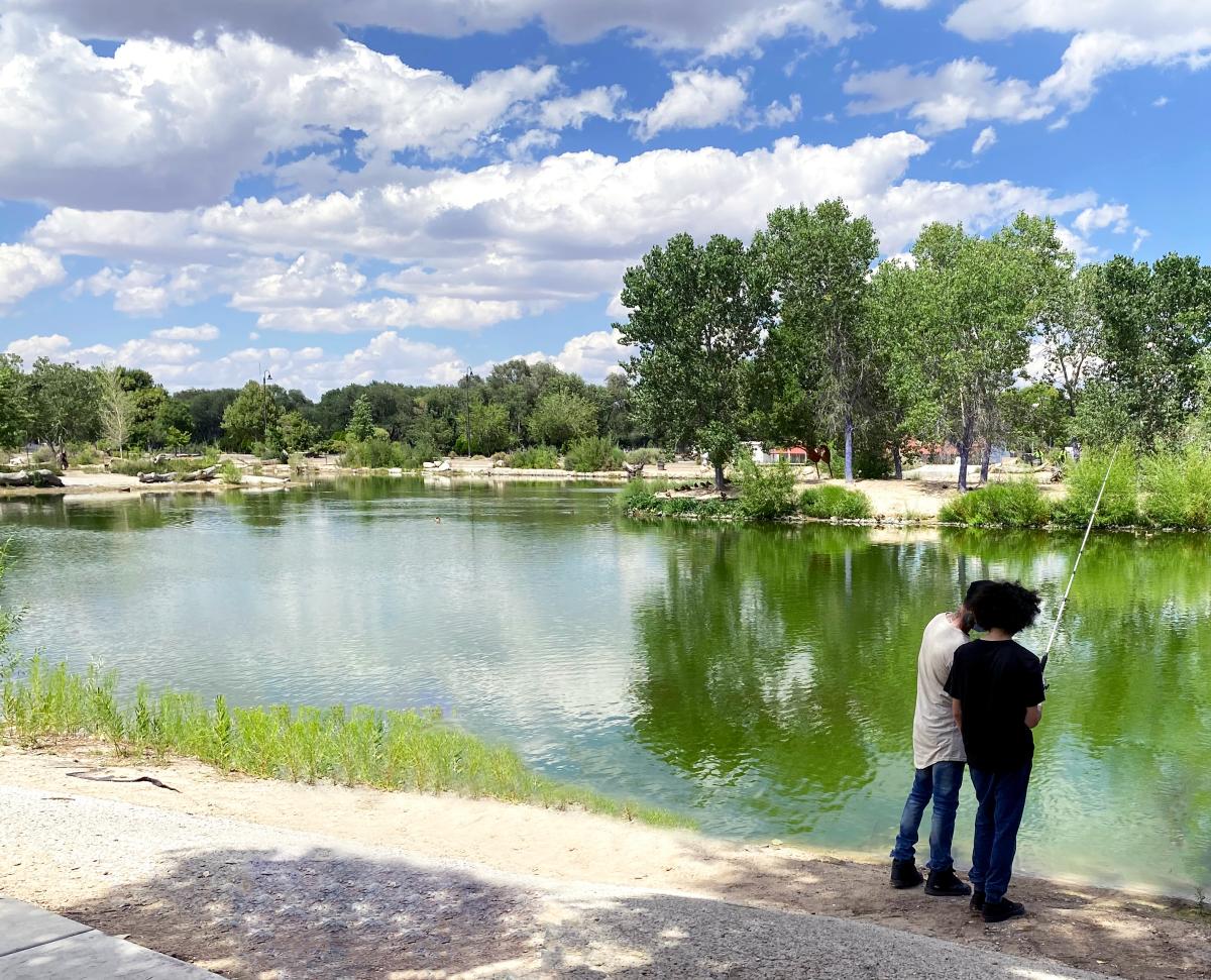 Father and son fishing at Tingley Beach, Albuquerque, New Mexico