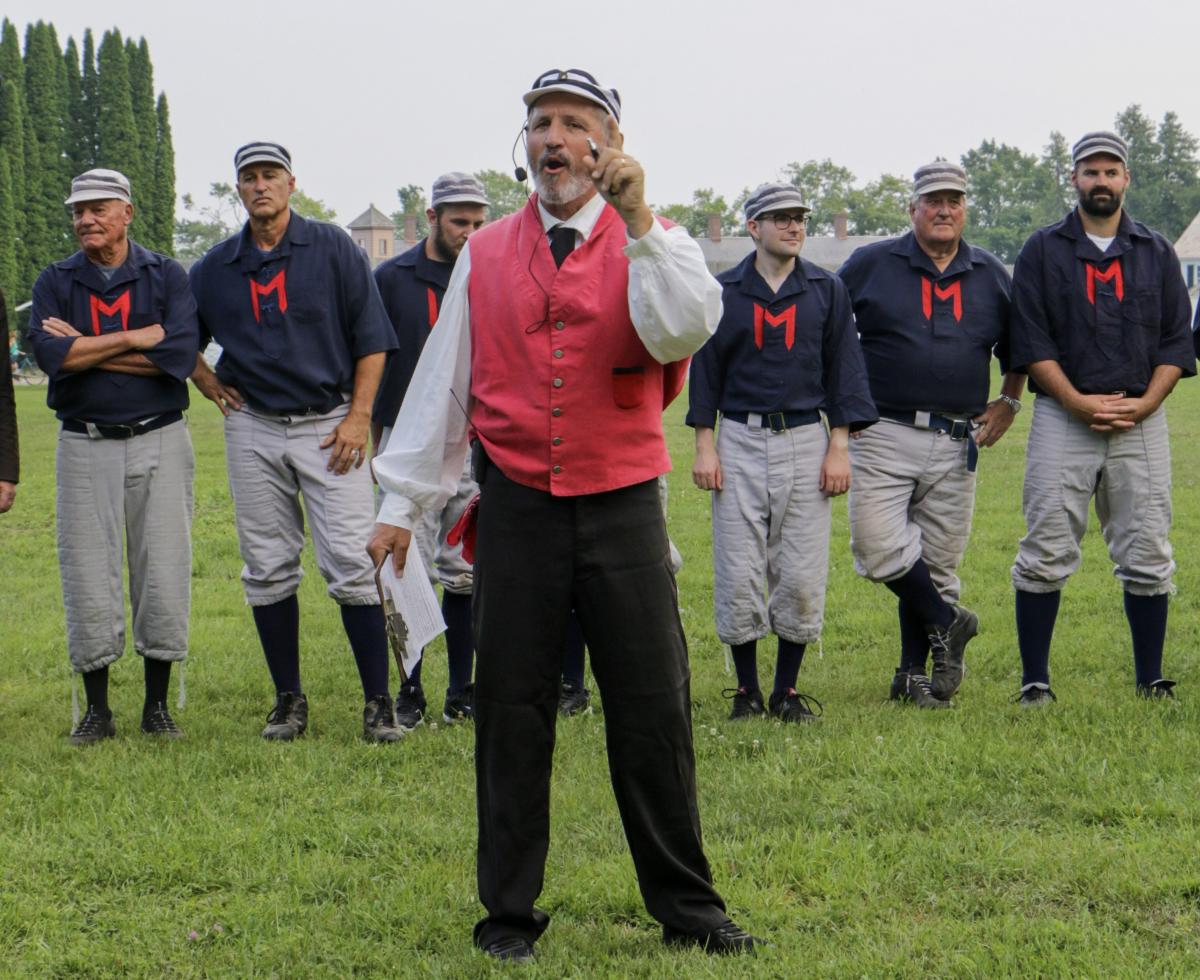 An umpire shouts instructions before a vintage base ball game on Mackinac Island