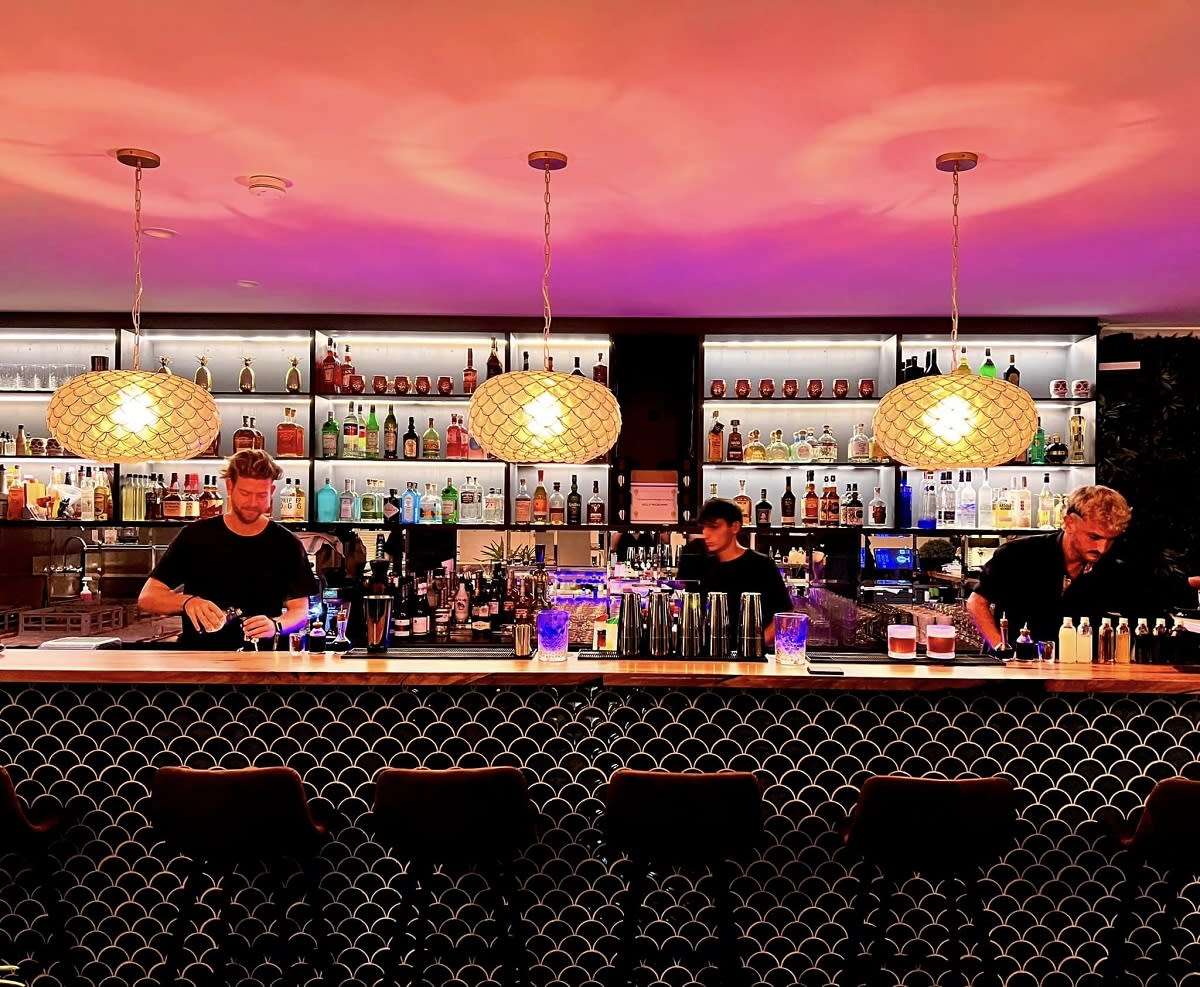 Bartenders behind the bar at the Broome Closet, in Broome Western Australia