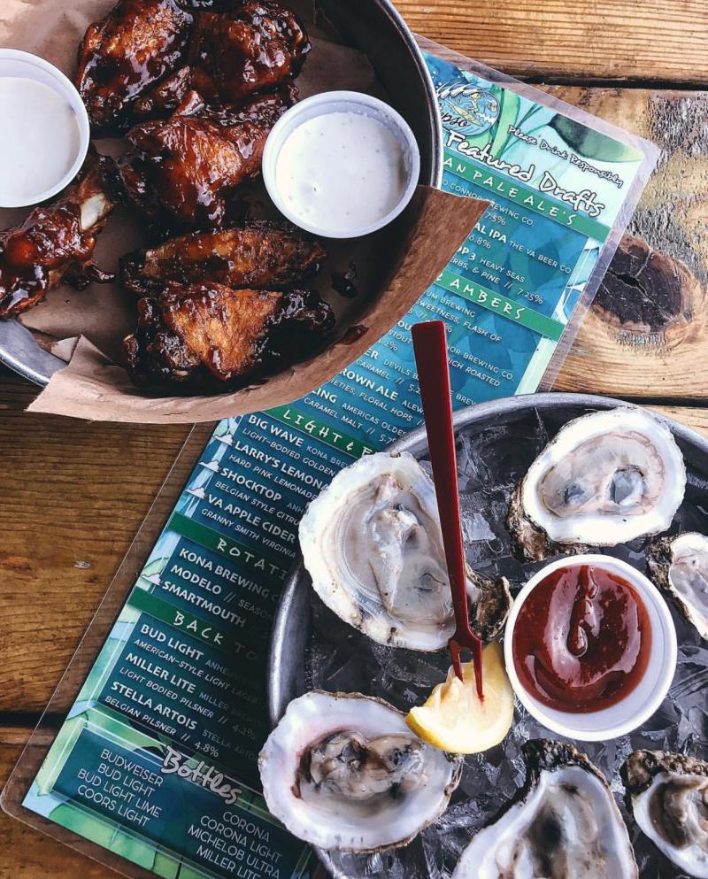 top down view of a dish of oysters and wings