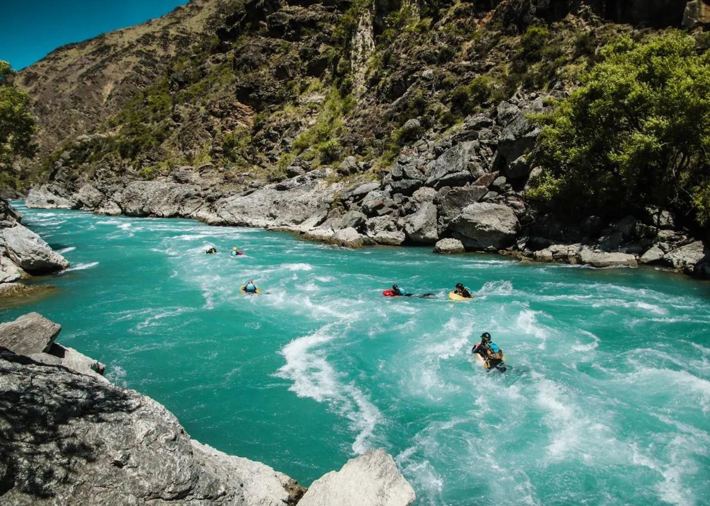 Group of people boarding down the river