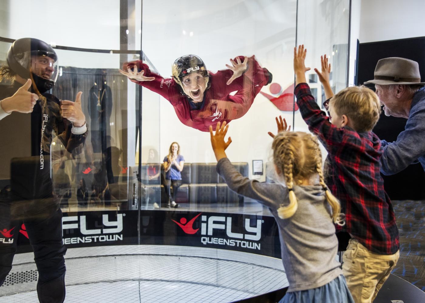 Woman flying in the wind tunnel at iFly Queenstown