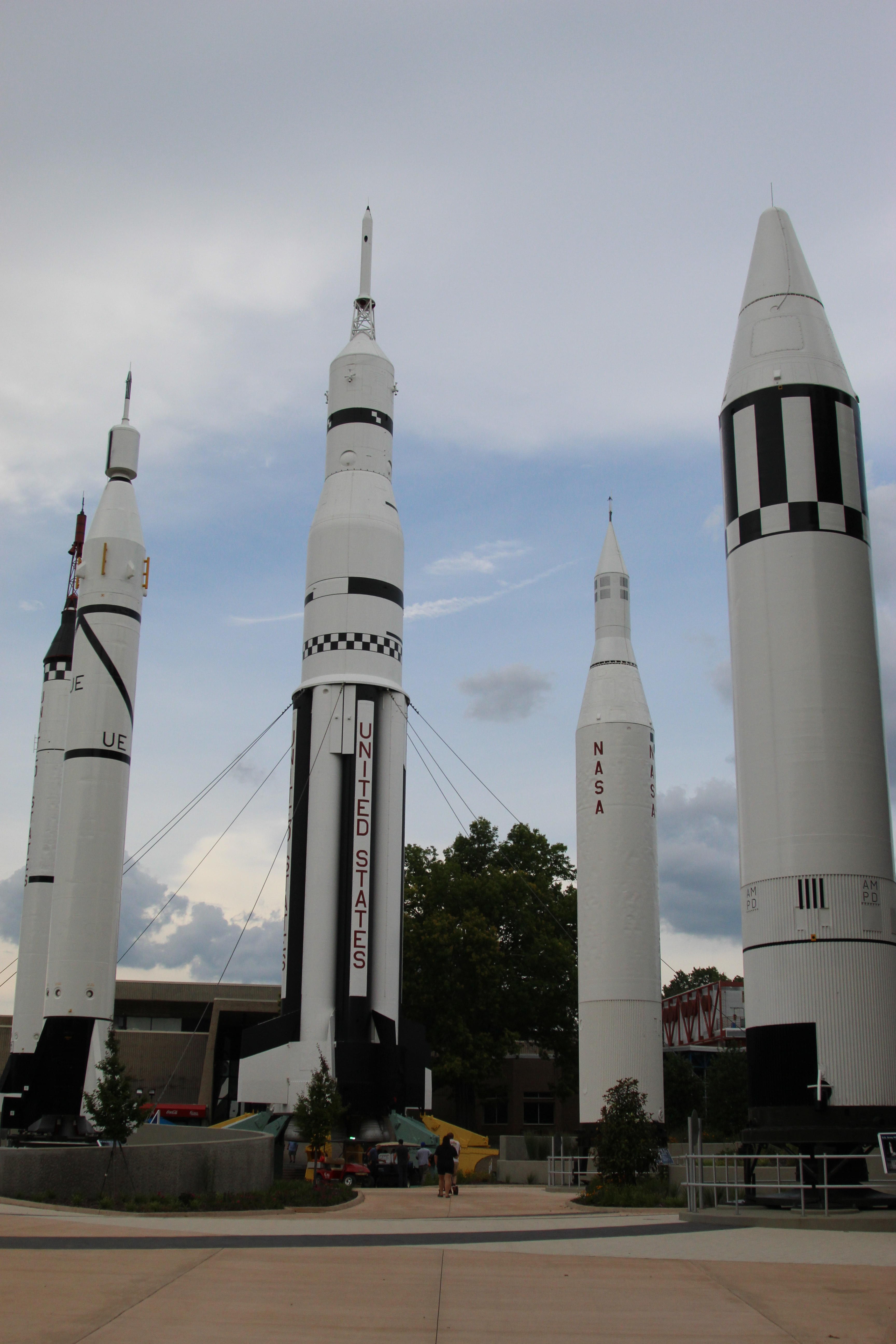 Four vertical black and white rockets in Rocket Park at the US Space and Rocket Center.