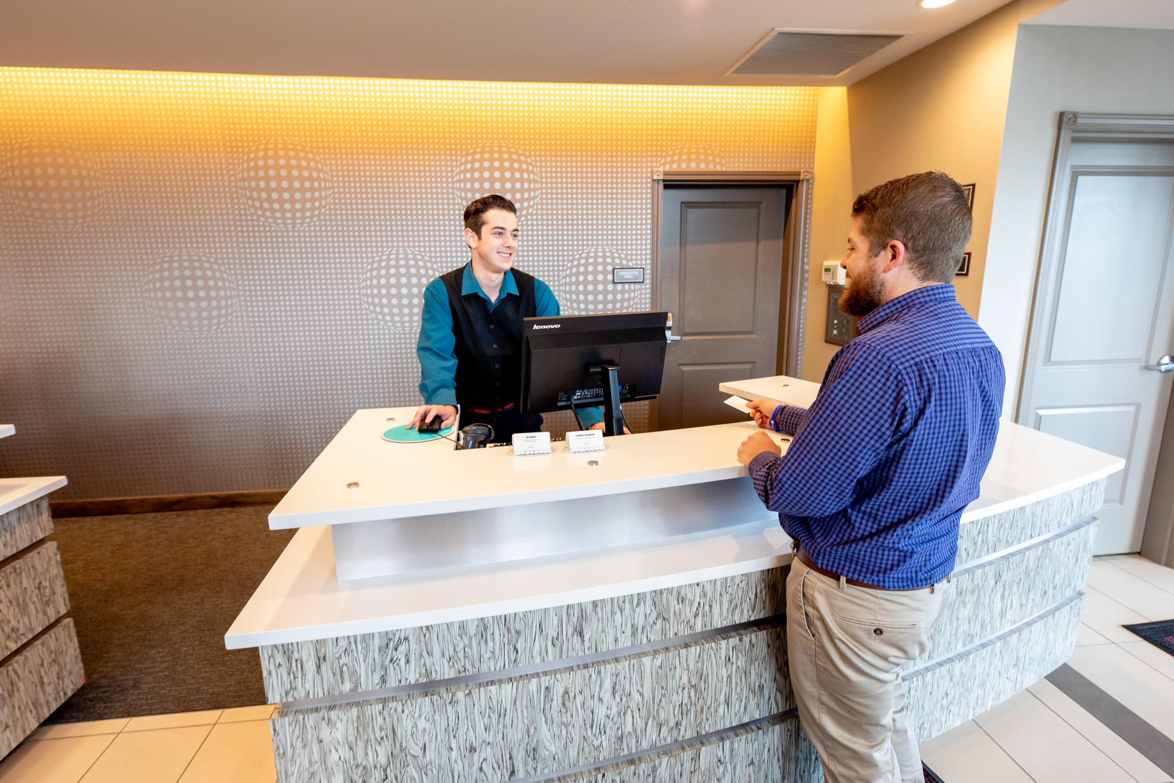 Man at Hotel Reception Desk