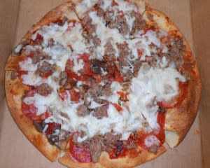Gluten free pizza at Casa includes some variety in pizza toppings - in this case, sausage pepperoni and cheese.