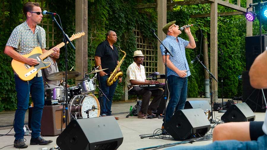 Three men playing jazz on a stage