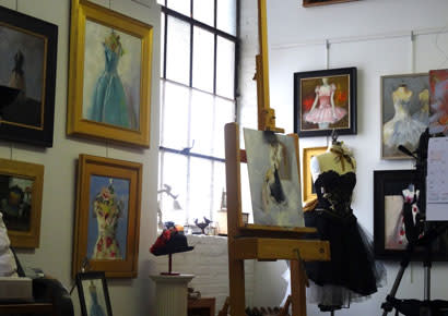 Art studio surrounded by paintings