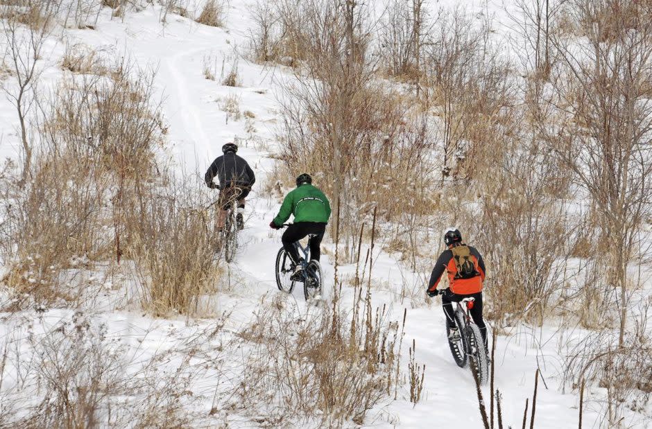 Fat biking up a snowy hill