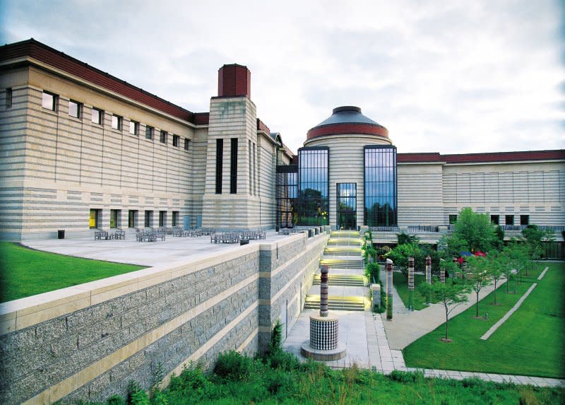 The grounds of the Minnesota History Center with the stone-hued building in the background