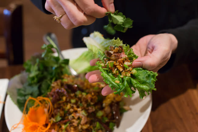 rice balls that have been fried until crispy, then tossed with ground pork