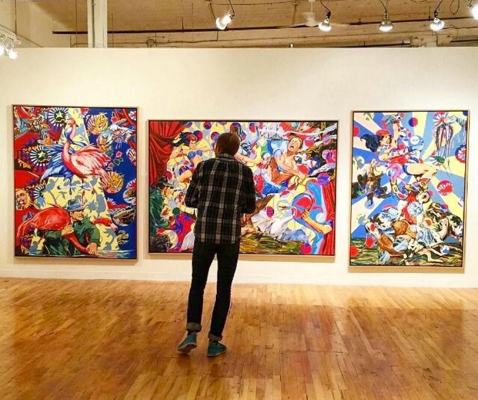 Person standing in gallery at Northrup King Building