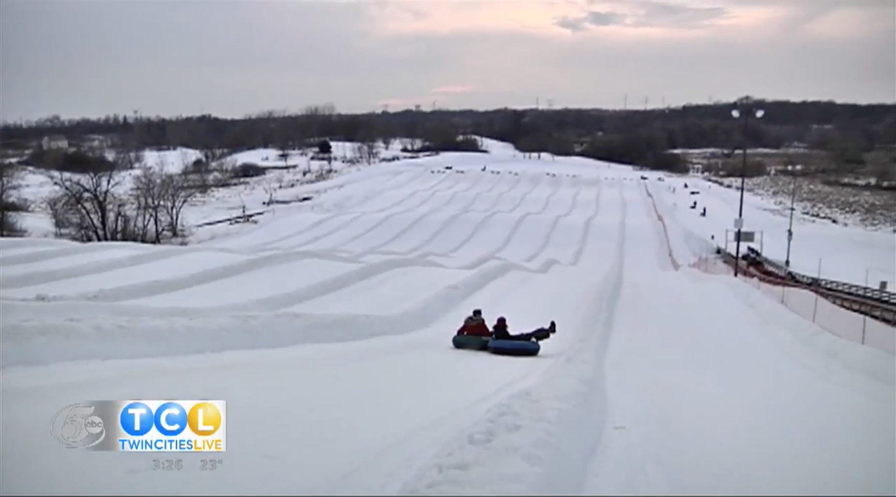 snow tubing down large hill