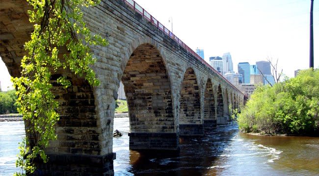 The Stone Arch Bridge with the city of Minneapolis in the background