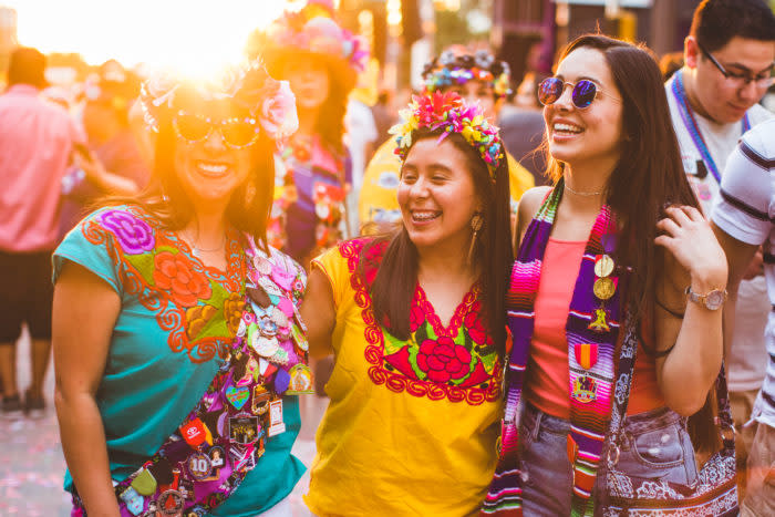 Three women laughing at Fiesta