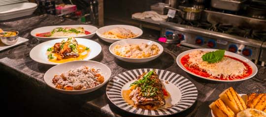 Plated dishes on display in restaurant kitchen
