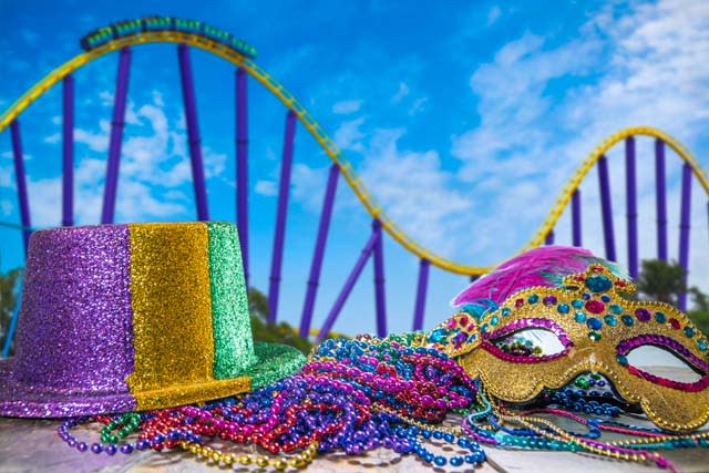 Mardi Gras decor in front of roller coaster