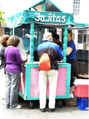 Fajita tacos at the pink food cart at El Molero draw hungry locals and visitors to the Plaza.