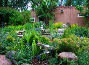 Rocks, plants, adobe … what could be more Santa Fe than being behind adobe walls? (Photo Credit: Santa Fe Garden Club)