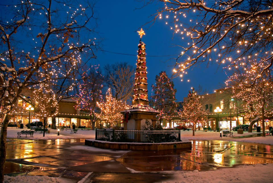 The historic Santa Fe Plaza is picture-perfect at the holidays, and so is gift-hunting at surrounding shops.