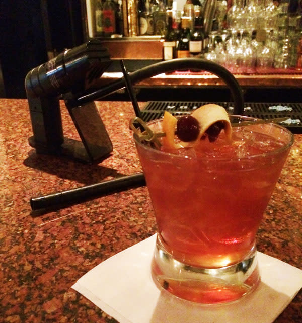 The infuser is the secret weapon for the Living Room’s smoky offering.