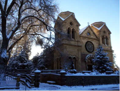 Wrapped up in white, the architectural beauty of Santa Fe's St. Francis Cathedral is a holiday delight.