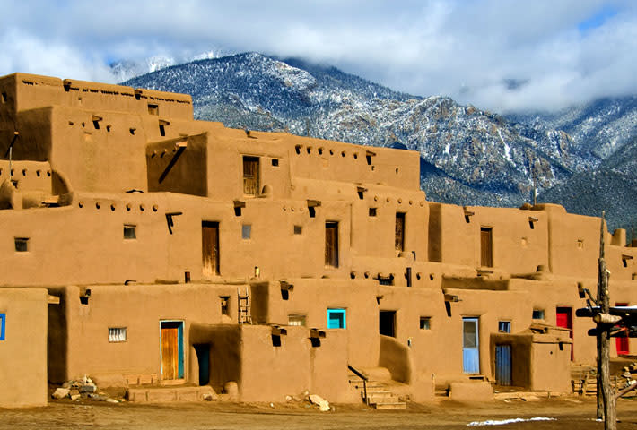 The Taos Pueblo is located 70 miles from Santa Fe in Taos, New Mexico.