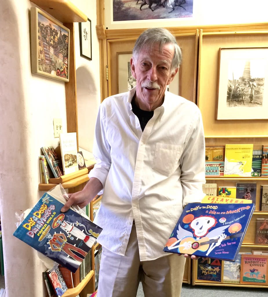 Jim Dunlap of Alla Bookstore with some of his Day of the Dead books for sale.