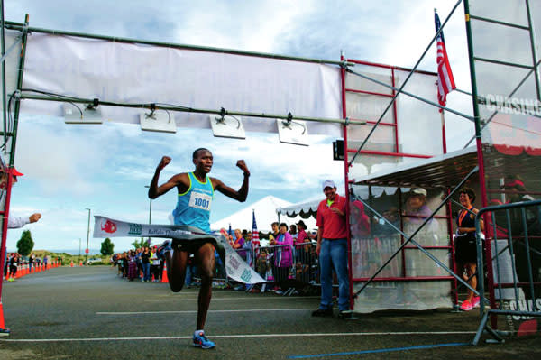 Kenya’s Oyugi set a course record in the 2013 Santa Fe Thunder half-marathon. (Photo Credit: Katharine Egli for The Santa Fe New Mexican) 