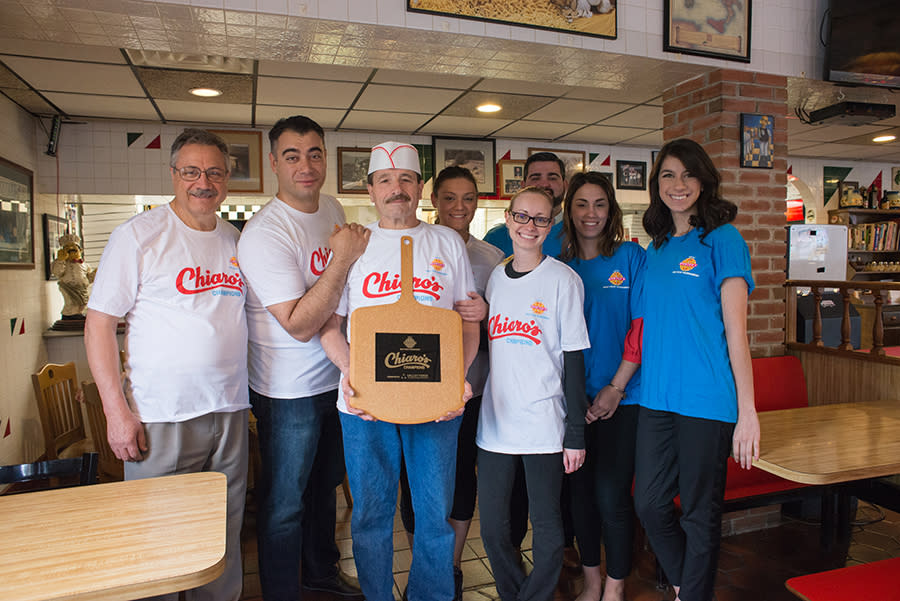 Chiaro's Pizza and Our Staff Show Off the Trophy