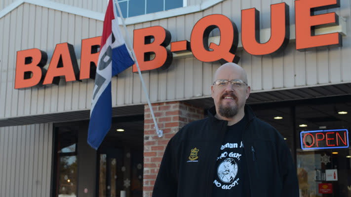 Bob Shoudt poses outside his sponsor, Phamous Phil's BBQ Bob Shoudt poses outside his sponsor, Phamous Phil's BBQ