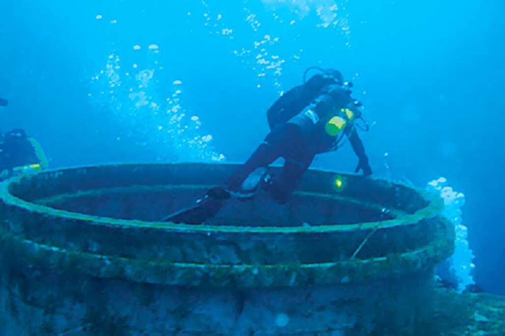 A diver swims at the U.S.S. Oriskany reef dive site