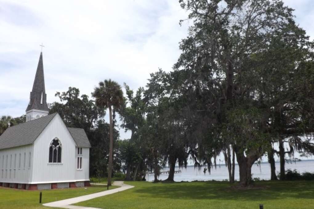 A small church with a picturesque backdrop of the St. Johns River