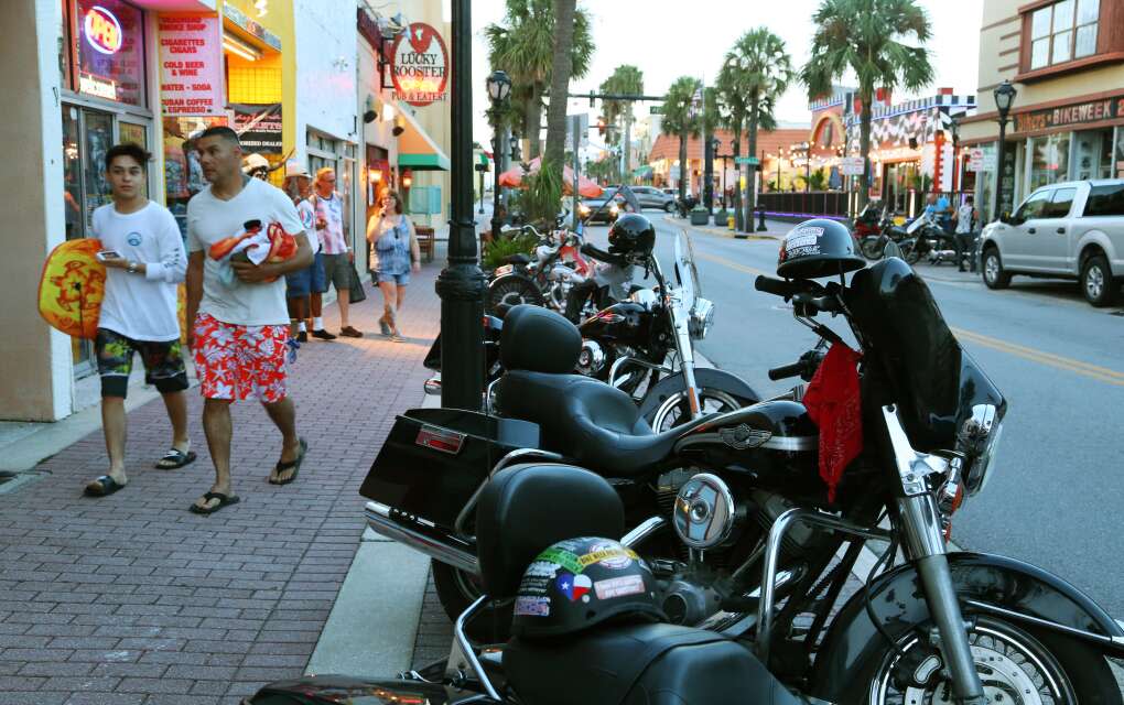 Harley-Davidson motorcycles are parked along Main Street in Daytona Beach. The city hosts Bike Week in March and Biketoberfest in October which attract thousands of bikers. 