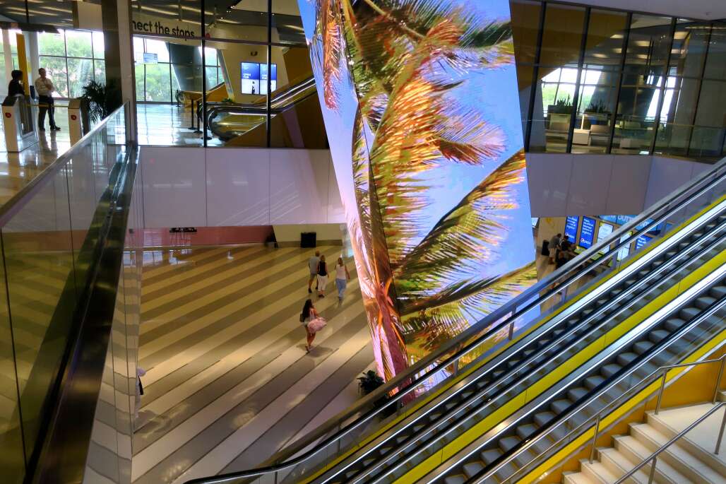 Brightline's Miami Central's lobby features a three-story LED art installation with ever-changing Miami scenes. 