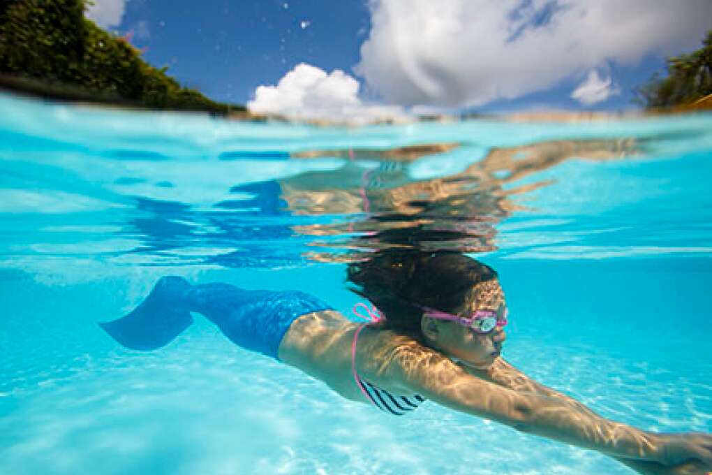 Gianna Horne, 8, dives using her monofin during The Mermaid Academy at the Hyatt Regency Grand Cypress.