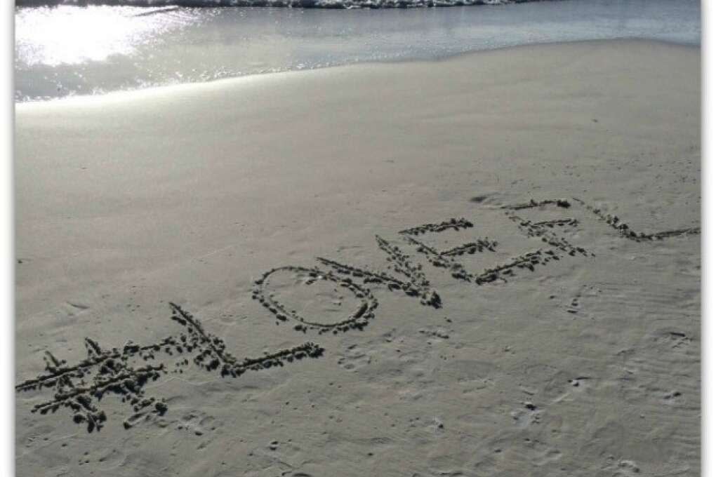 #LOVEFL written on the Anna Maria Island shore sands