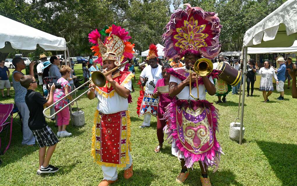 trombone players dressed in traditional garb at the inaugural Back to Angola festival at Manatee Mineral Spring Park in 2018, in Bradenton