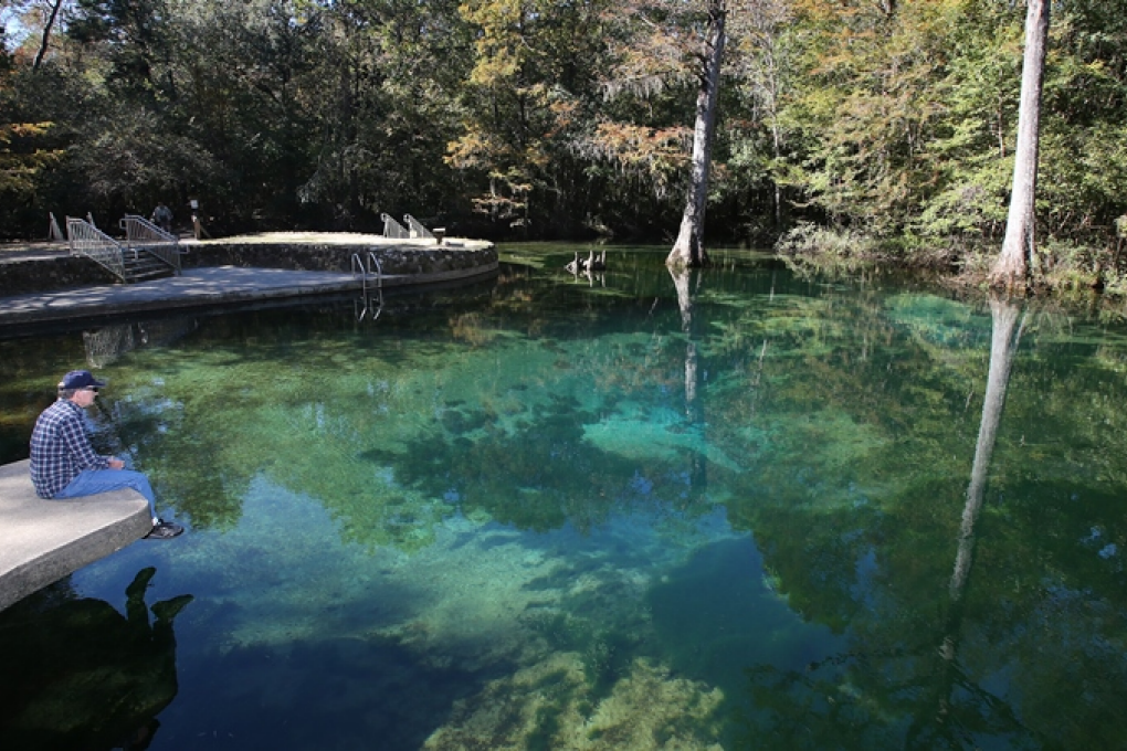 A visitor enjoys a quiet morning at Ponce de Leon Springs.