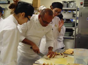 A Chef at John Purdue Room plating scrumptious delights!