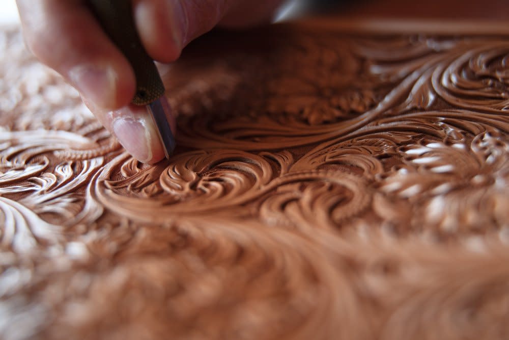 hand carving details in leather