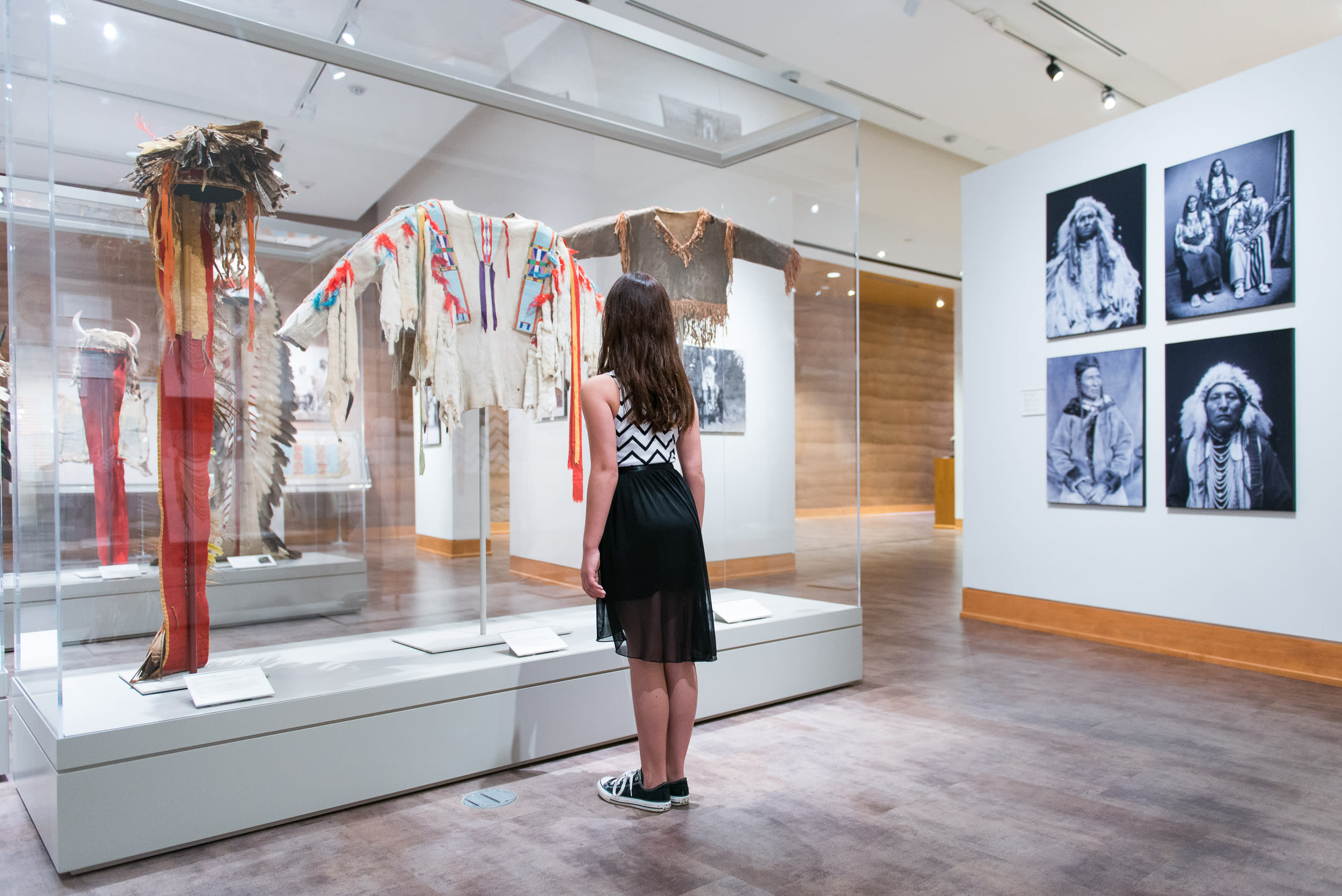 A girl looking at an exhibit in Sheridan, WY, during a weekend getaway.