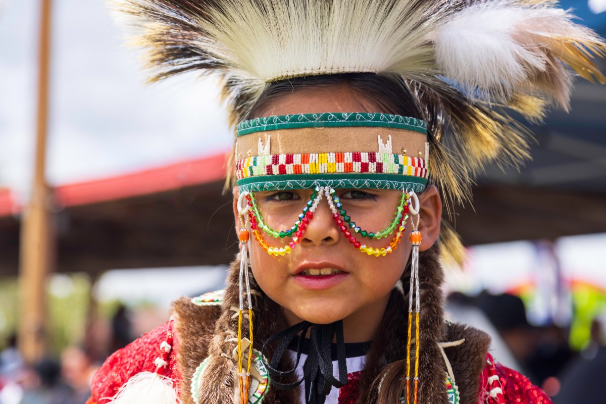Boy dressed in traditional regalia.