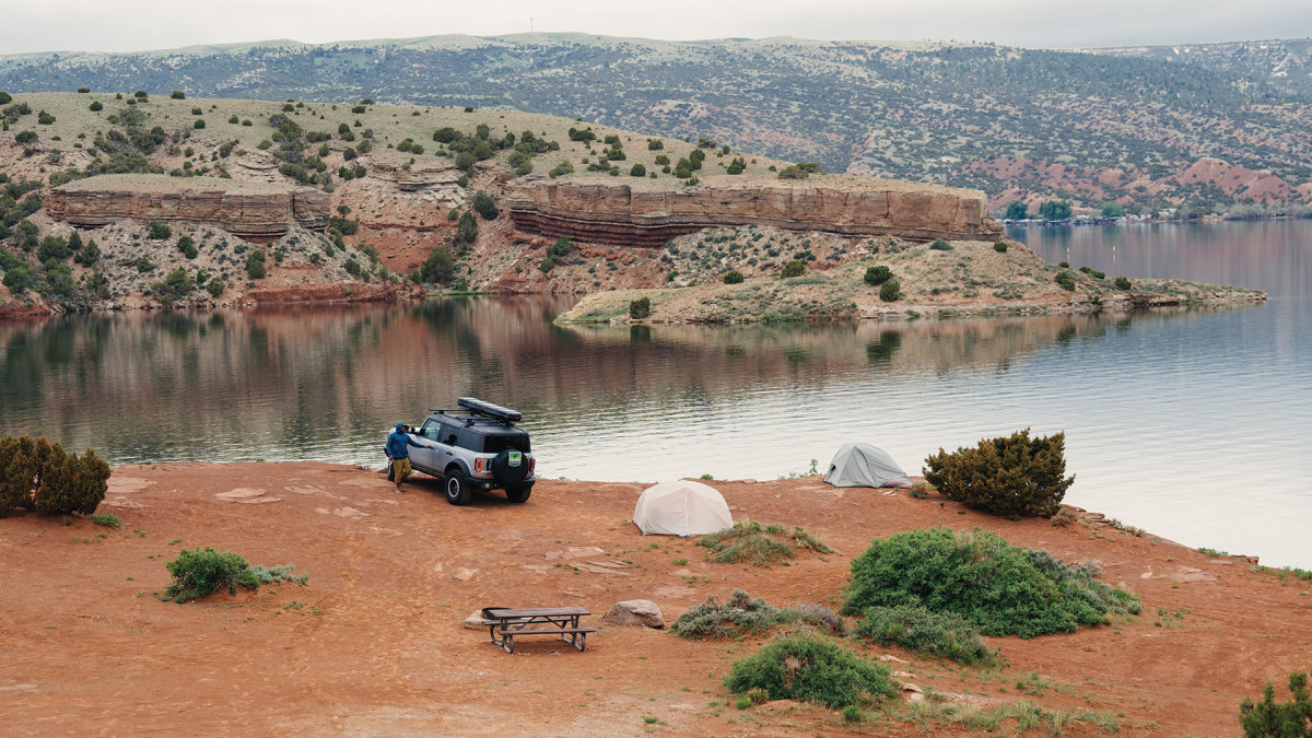 Camping Wyoming's wide open spaces on the edge of a reservoir.