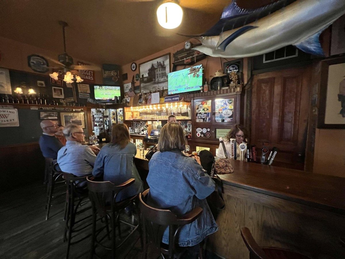 Patrons enjoying a drink at the bar.