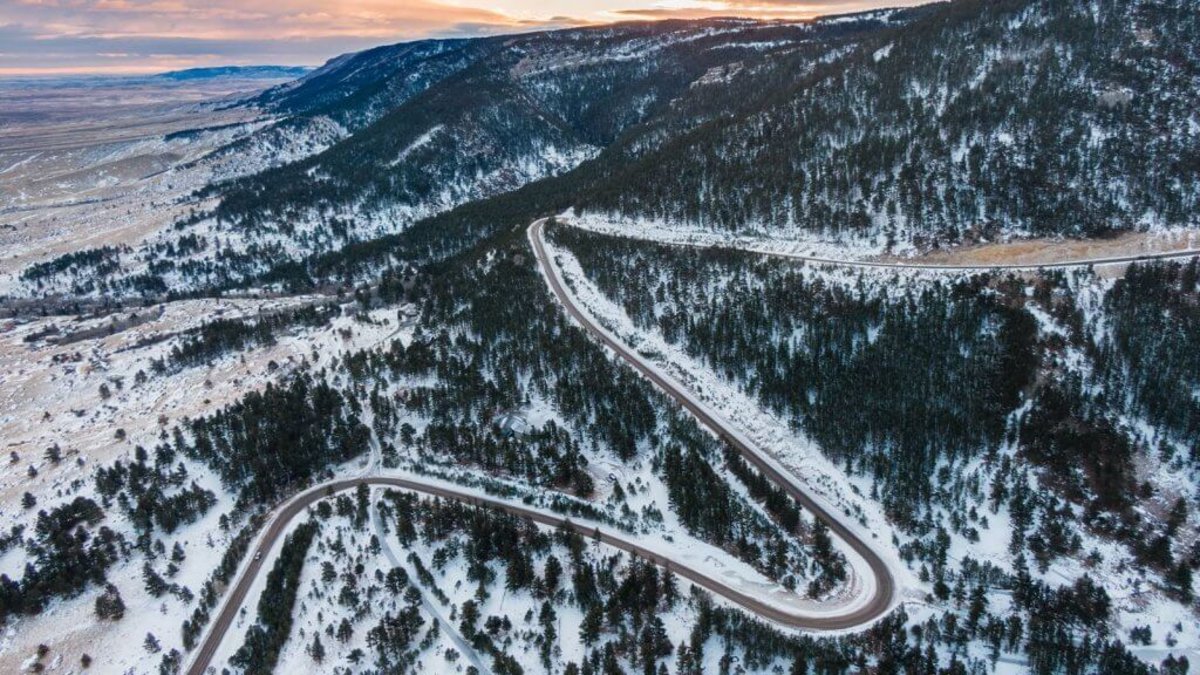 A winding winter road snakes up Casper Mountain, Wyoming.
