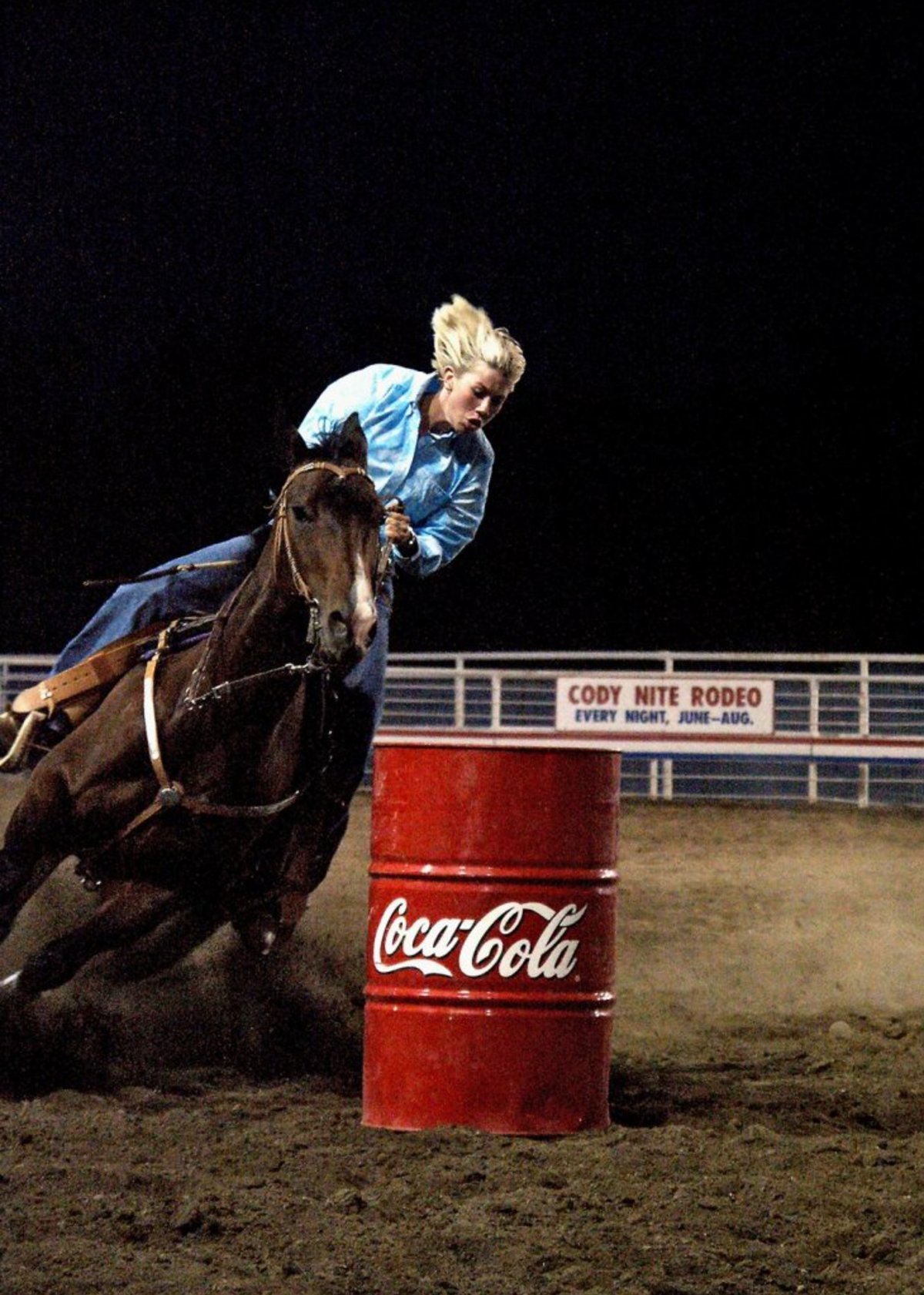 Lady on horse barrel racing-Cody Nite Rodeo
