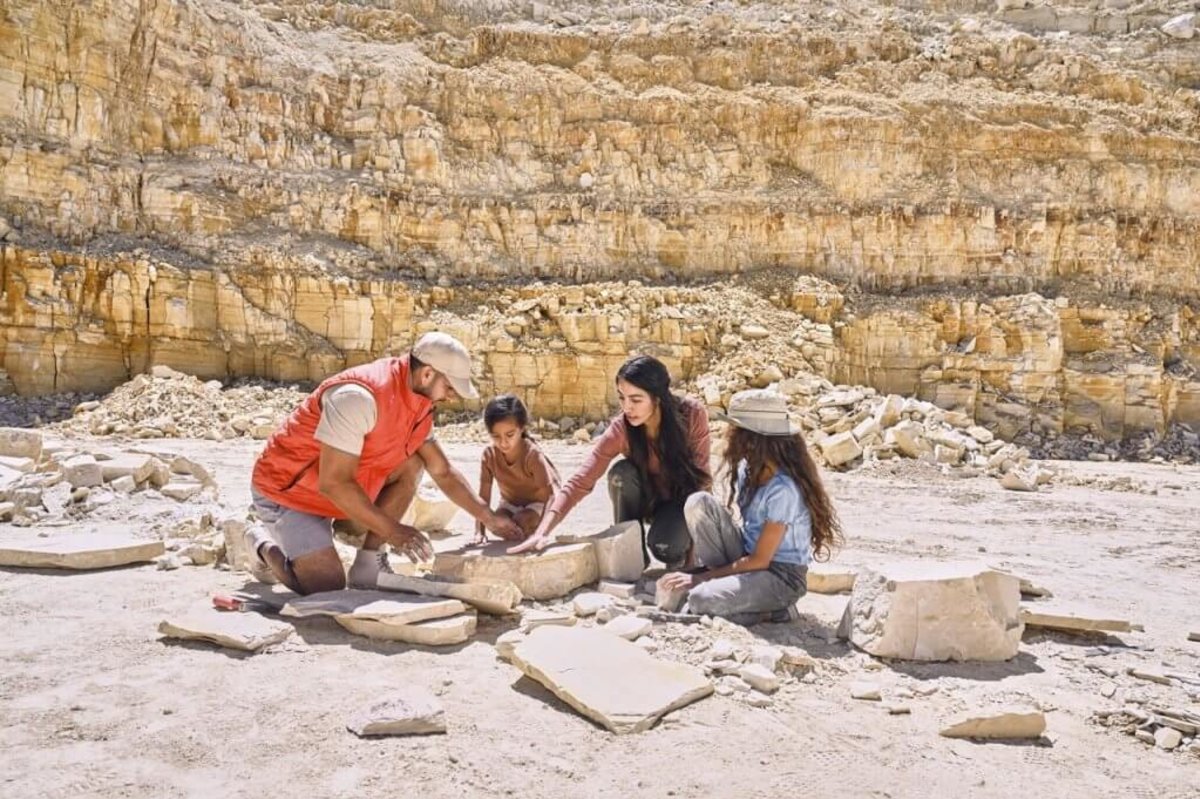 A family digging for fossils at the American Fossil Quarry.