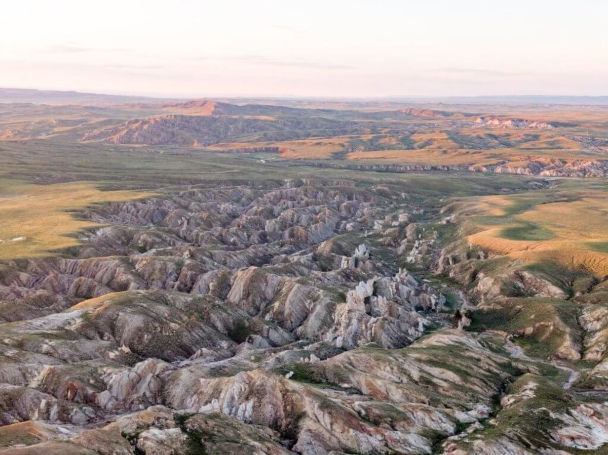 The sprawling rocky landscape of Hell's Half Acre surrounded by open plains.
