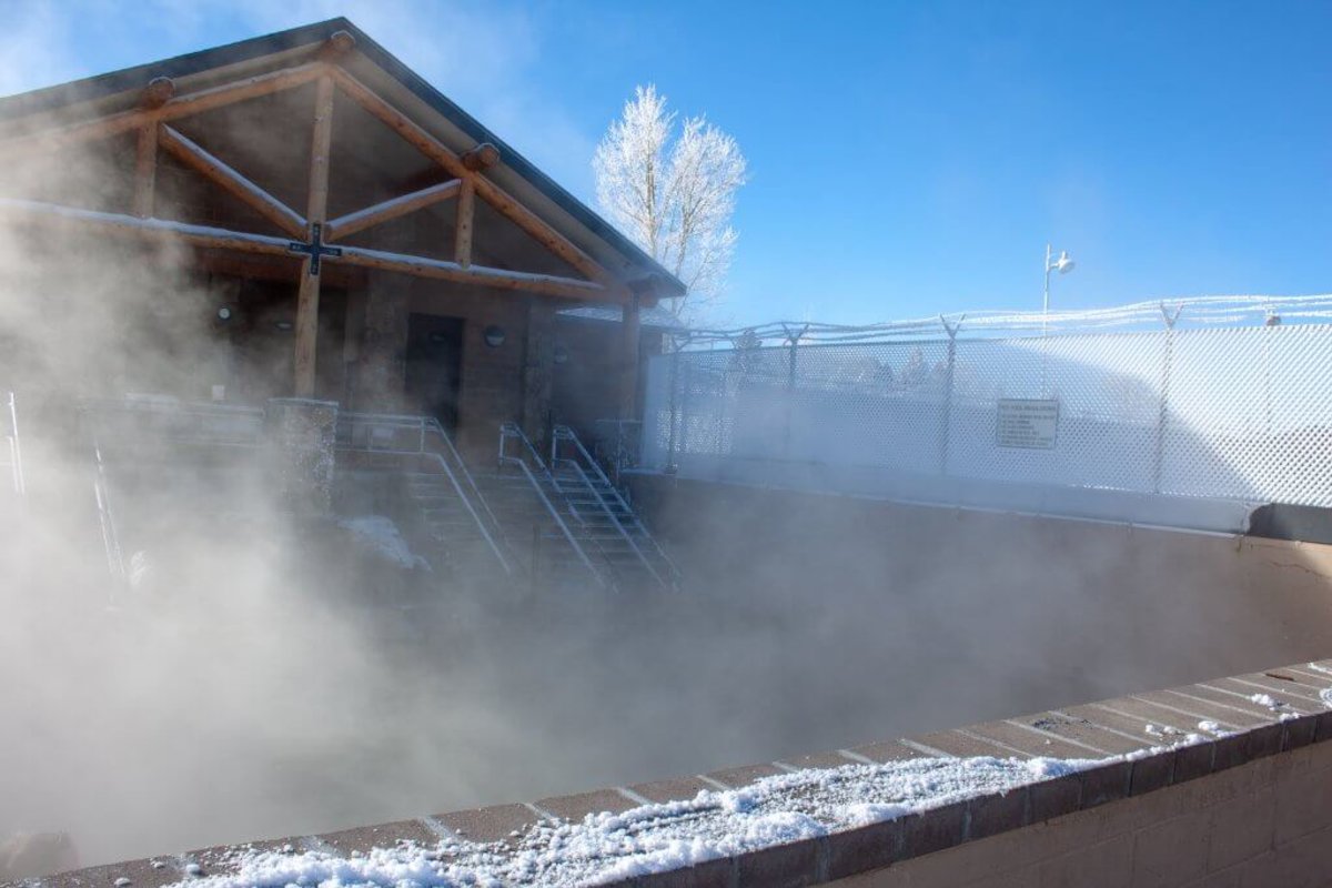 A steamy glimpse of the Hobo Hot Springs, a free public bathhouse in Saratoga, Wyoming. Snow dusts the outside perimeter.